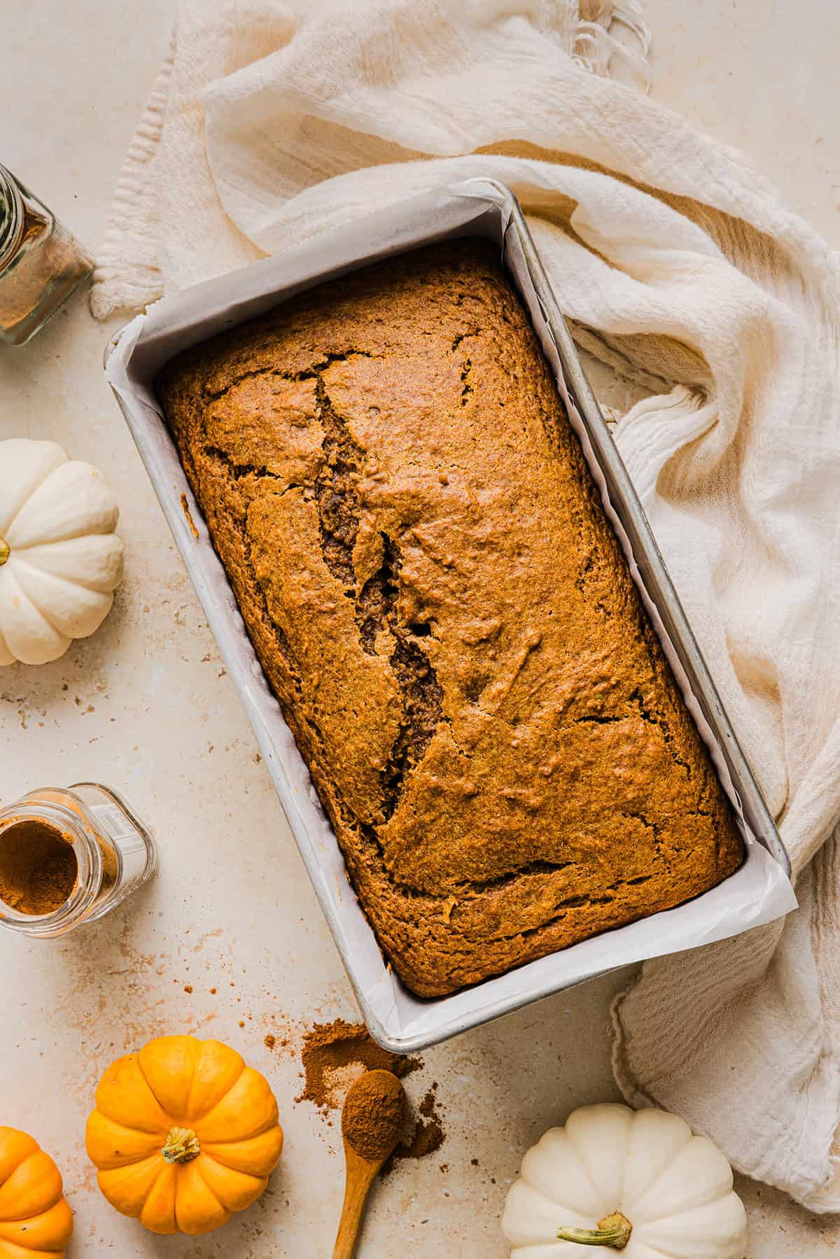 The BEST Healthy Pumpkin Bread that is moist, loaded with pumpkin flavor and made without any butter or refined sugar!  Topped with a delicious maple cream cheese glaze for the perfect fall treat this season!