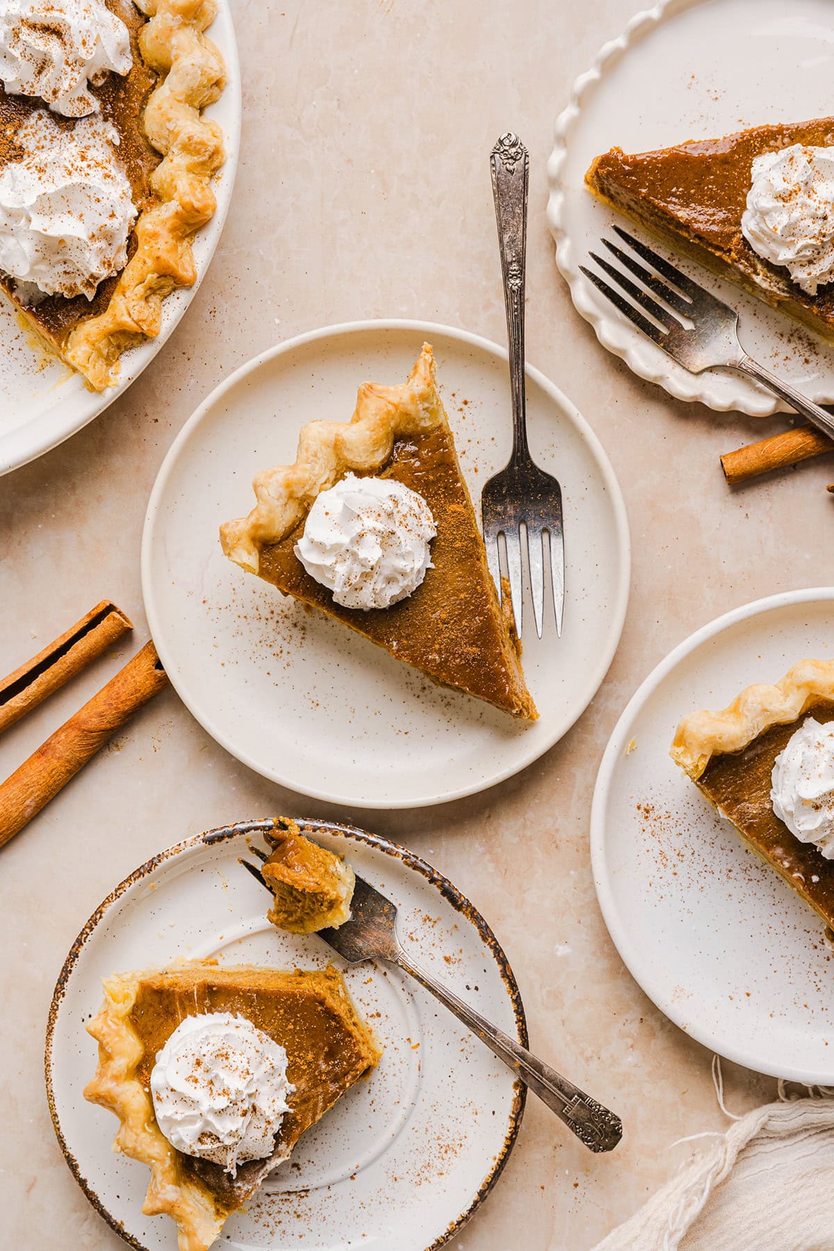 This creamy and delicious Healthy Pumpkin Pie makes the perfect holiday dessert! So easy to make, naturally sweetened with maple syrup and tastes great topped with whipped cream or vanilla ice cream!