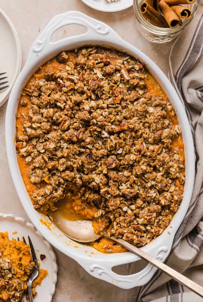 This Healthy Sweet Potato Casserole is a family favorite! A classic holiday side dish that tastes just as delicious as traditional sweet potatoes, but without any refined sugar and a wholesome pecan streusel topping!
